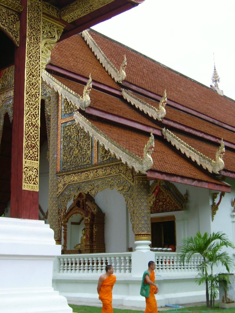 Travel inspiration - Monks walking outside a temple in Chiang Mai